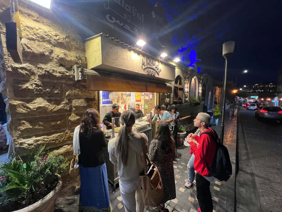 Amman: Women-Led Food Tour Through Amman’s Culinary Scene - Passing an old mosque, then moving through the food that surrounds it