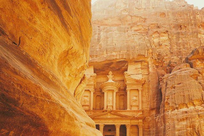 Best of Jordan Tour Amman Petra and Dead Sea with Camping at Wadi Rum - Entering Petra via the Siq, with a horse ride to manage the scale