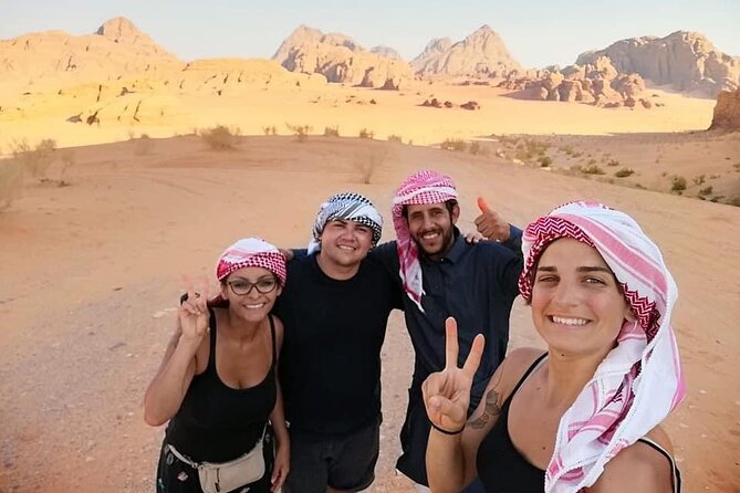 Wadi Rum 2-Day Jeep Tour with Meals and Overnight in Bedouin Camp - Red sand dune views and bridge climbing for real desert photos